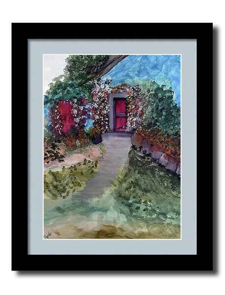 A watercolor painting framed print pathway bordered by lush greenery and vibrant flowers leads to an English country cottage with a red door.